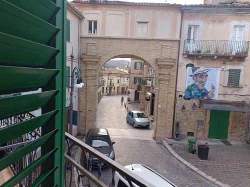 an archway in a city with cars parked on a street at A Casa di Lory in Atessa