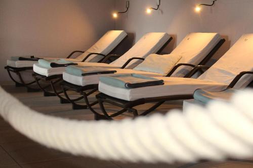 a row of mattresses lined up in a room at Hotel & Residence Hochriegel in Spiegelau