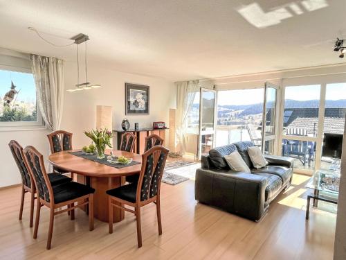 a living room with a table and a couch at Apartment Schwarzwaldblick IV by Interhome in Bernau im Schwarzwald