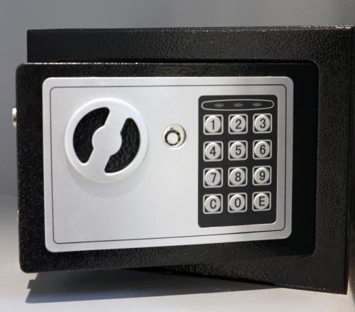 a close up of a black and white microwave at MyOtel - Santacruz in Mumbai