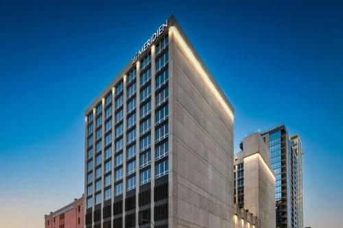 a tall building with the name on top of it at Le Meridien Fort Worth Downtown in Fort Worth