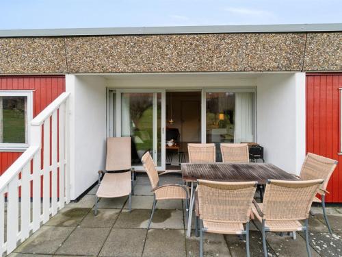 a table and chairs sitting on a patio at Apartment Markus - 300m from the sea by Interhome in Allinge