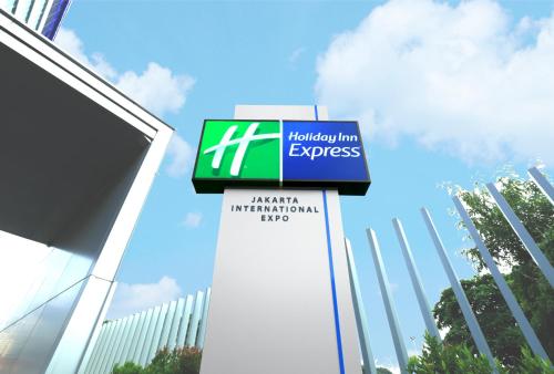 a sign for a holiday inn express in front of a building at Holiday Inn Express Jakarta International Expo by IHG in Jakarta