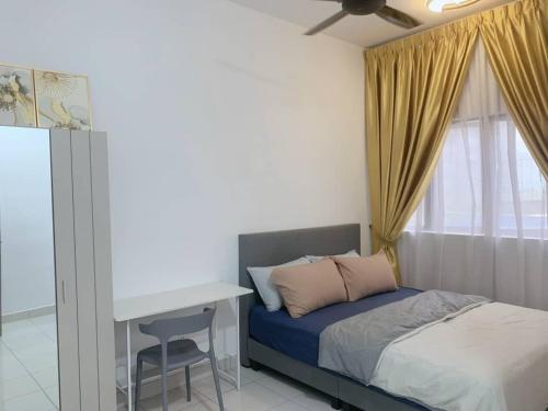 a bedroom with a bed and a desk and a window at Youth City Residence, Nilai Fully furnished 2 rooms in Nilai