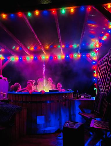 a group of people in a room with lights at Park Wilkasy in Gołdap