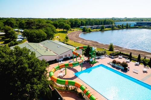 an aerial view of a water park with a water slide at Chalet 2124 - Camping De Schatberg in Sevenum