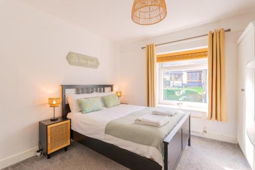 Ένα ή περισσότερα κρεβάτια σε δωμάτιο στο The Nest Superb Apartment In Afan Forest Bike Park By Staystaycations