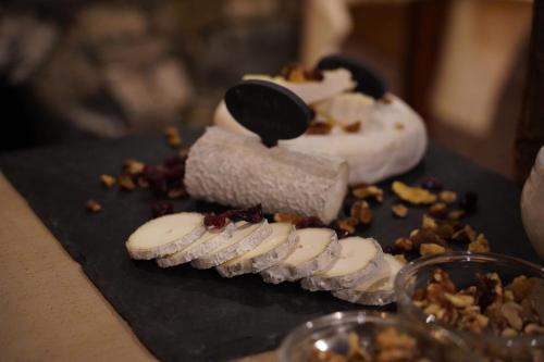 a dessert with sliced bananas and nuts on a table at Hôtel Le Sherpa Val Thorens in Val Thorens
