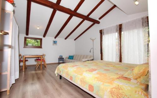 a bedroom with a bed and a table in it at Studio Rovinj Home in Rovinj