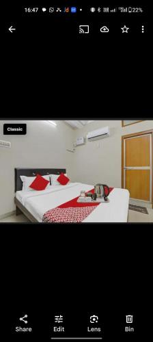 a picture of a hotel room with two beds and a keyboard at Hotel khushboo Regency in Deoria