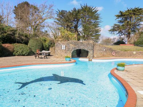 a swimming pool with a shark projected on the water at Millers Loft in Ivybridge
