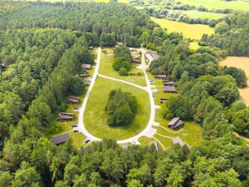 an aerial view of a park with houses and trees at Thorpe Forest Cabins - Forest Holidays in Thetford