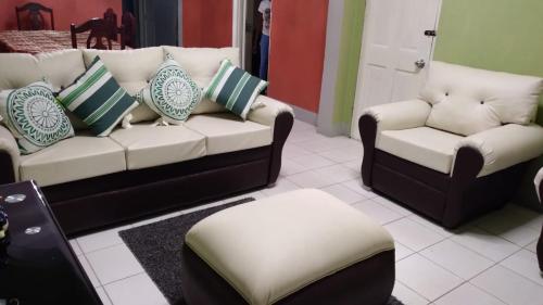 a living room with a couch and two chairs at Charming Kingston Room for Rent - Private Entrance Full Access in Four Mile