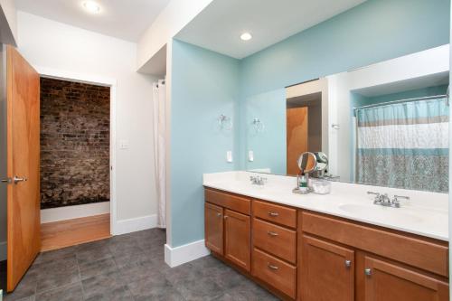 a bathroom with a sink and a mirror at The Quiet Old City Hideout in Knoxville