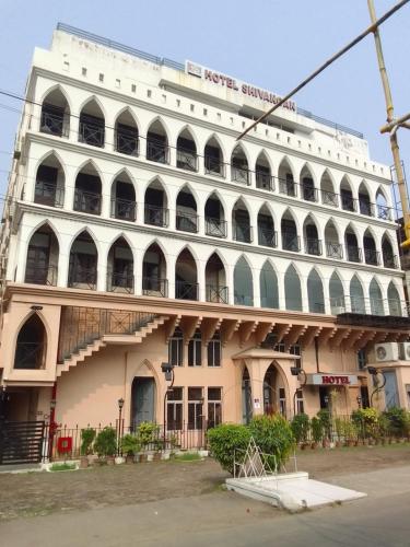 a large white building with a lot of windows at SHIVANGAN HOTEL and BANQUET in kolkata