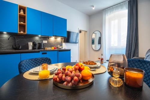a kitchen with a table with fruit on it at D&A Central Luxury Apartments with FREE Parking in Pula