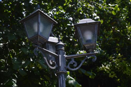 a street light with two lights on top of it at Къща за гости Mia Maria in Tutrakan