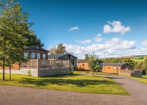 a home with a deck and a house at Docker Holiday Park in Carnforth