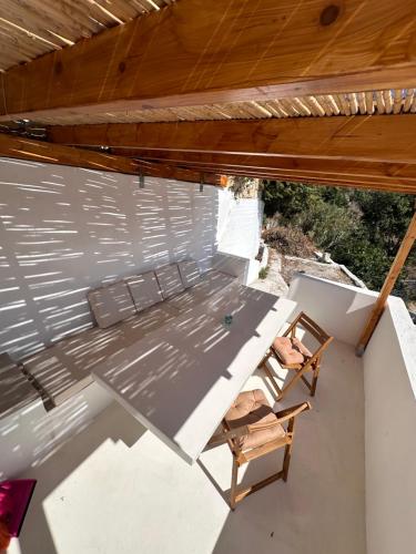 an overhead view of a table and chairs on a patio at Amerissas studios 1 in Skiros