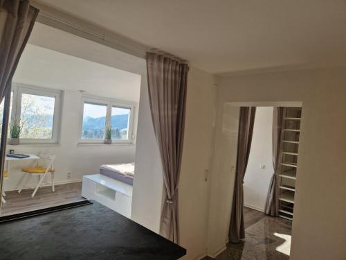 a white room with a bed and a window at Auszeit am Weinhof in Loschenthal