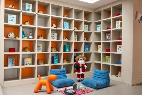 a childs room with legos in the book shelves at Sofitel Tamuda Bay Beach And Spa in M'diq