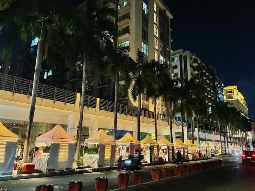 a row of tents on a city street at night at NAIA Terminal 3 Condo Newport with WIFI Netflix Pool in Manila