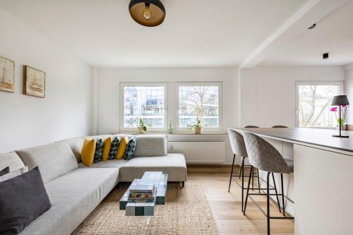 a living room with a couch and a table at 1 bedroom flat 55m2 in the city in Luxembourg