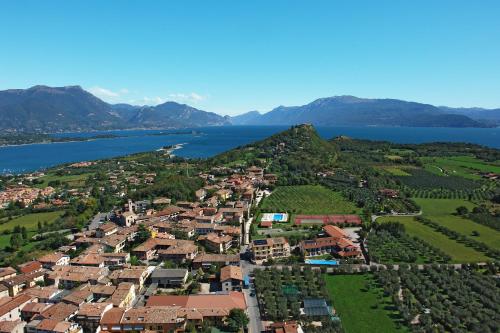 an aerial view of a small town next to a lake at Spa Hotel Splendid Sole in Manerba del Garda