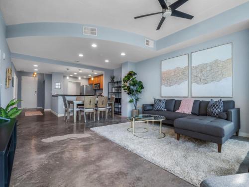 a living room with a couch and a table at Luxurious 2 Beds 2 Baths Downtown Apartment in Orlando