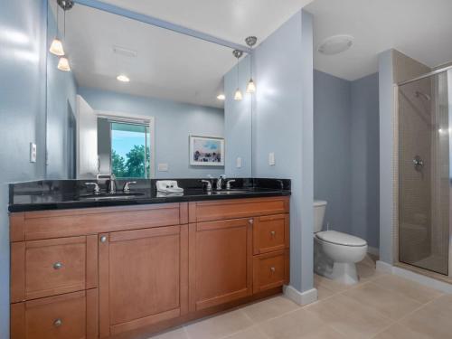 a bathroom with a sink and a toilet at Luxurious 2 Beds 2 Baths Downtown Apartment in Orlando