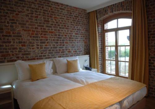 Postel nebo postele na pokoji v ubytování Hostellerie De Biek