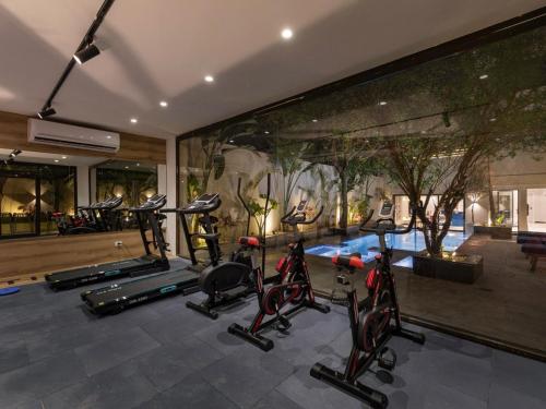 a gym with several exercise bikes in a room at 22 by spacey #54 Studio in Maadi in Cairo