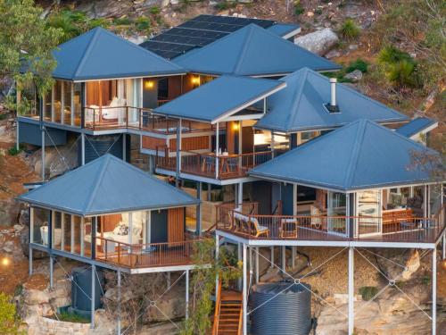 an aerial view of a house with blue roofs at Pagoda Point in Bar Point