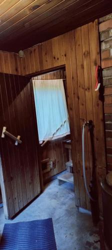 a small room with a door and a window at Spacious Apartment for 8 with Sauna in Sievi