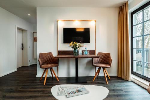 Телевизор и/или развлекательный центр в Hotel Ostseeland