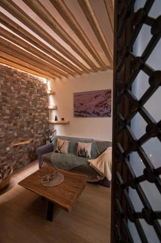 a living room with a couch and a table at PineNpeak in Arachova