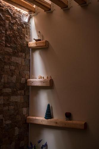 a room with wooden shelves on the wall at PineNpeak in Arachova