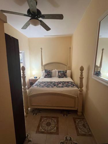 a bedroom with a bed with a ceiling fan at Steps Away from Adventure -2bedroom & 1 Bath in Turtle Cove