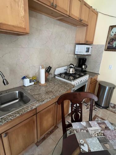 a kitchen with a sink and a stove at Steps Away from Adventure -2bedroom & 1 Bath in Turtle Cove