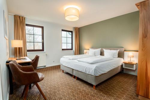 Кровать или кровати в номере Hotel Ostseeland