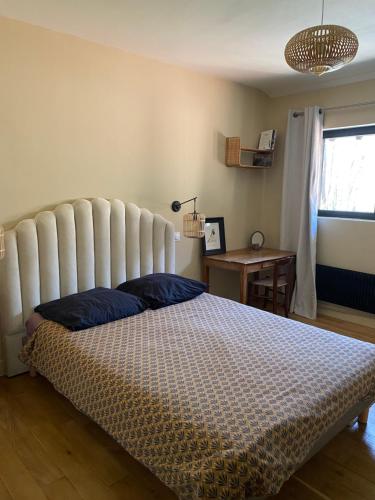 Ένα ή περισσότερα κρεβάτια σε δωμάτιο στο Lodge de Loire - B & B proche Chambord