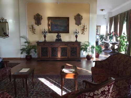 a living room with a couch and a table at Hotel Sirius in Taormina