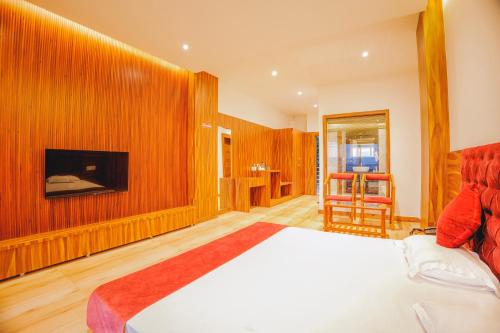 Postel nebo postele na pokoji v ubytování Jamunas B&B