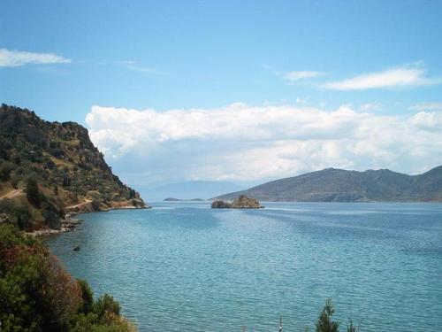 a view of a large body of water with mountains at Iridanos in Antikyra