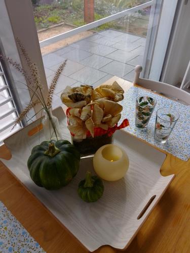 a table with two pumpkins and a candle on it at Das kleine Lavendelhaus in Kahl am Main