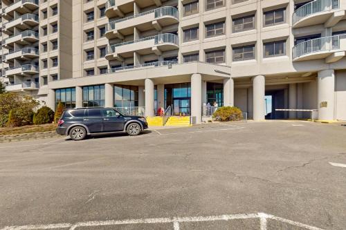 a car parked in a parking lot in front of a building at Sugar Top 2524 in Sugar Mountain