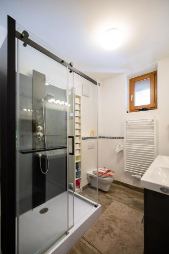 a bathroom with a glass shower and a toilet at Gästehaus Tanja & Claus in Eisenstadt