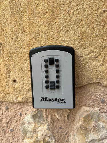a black and white object on the side of a wall at La Casa El Cura in Campillo de Dueñas