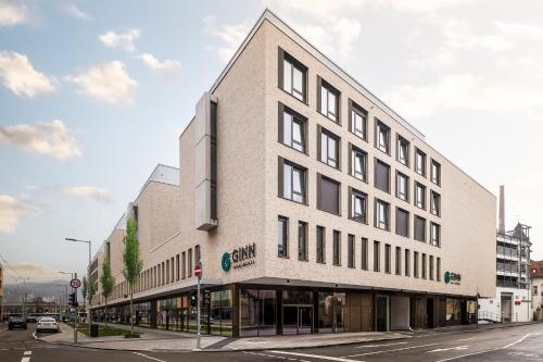 a building on the corner of a street at GINN Apartment-Hotel Stuttgart-Esslingen in Esslingen