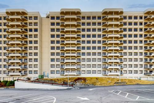 an apartment building with a parking lot in front of it at Sugar Top 2621 in Sugar Mountain